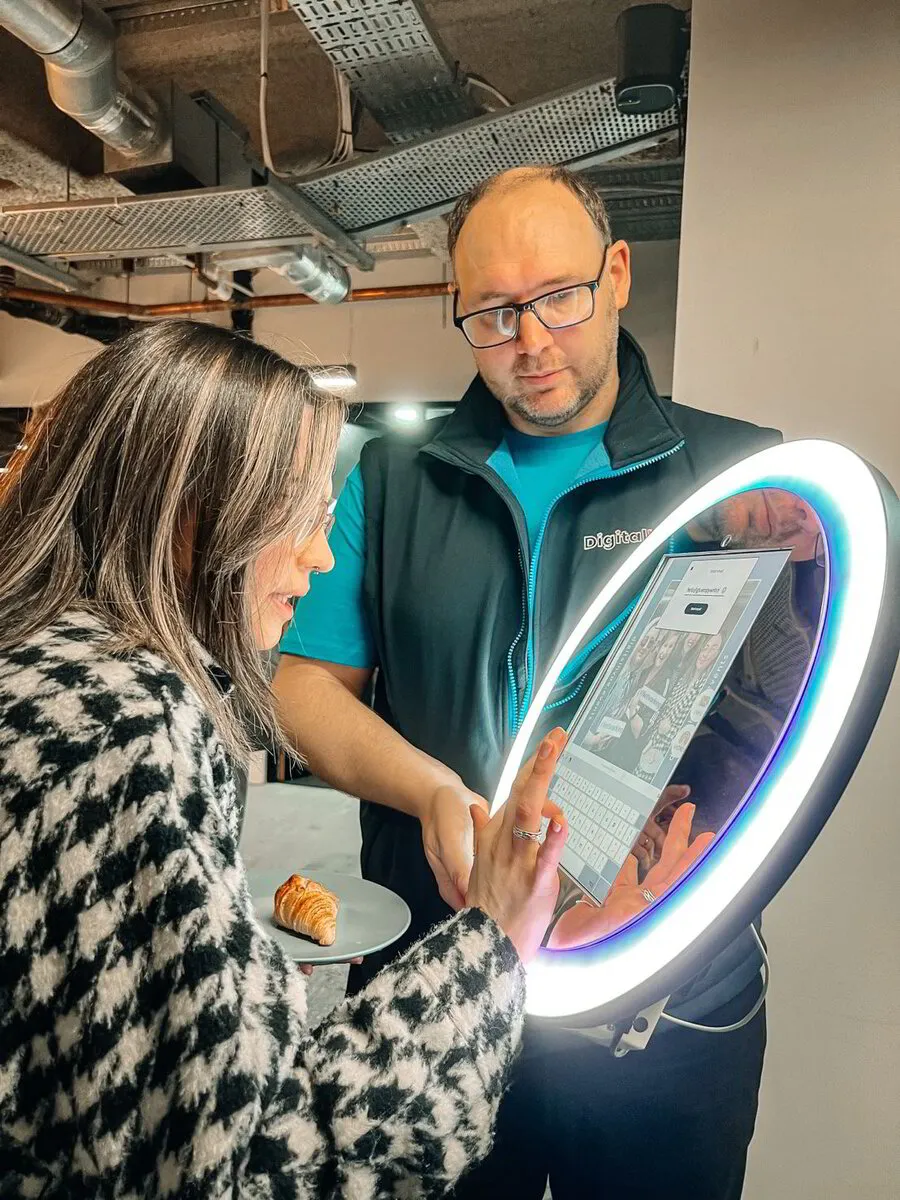 Diverse team reviewing a dashboard on a tablet together